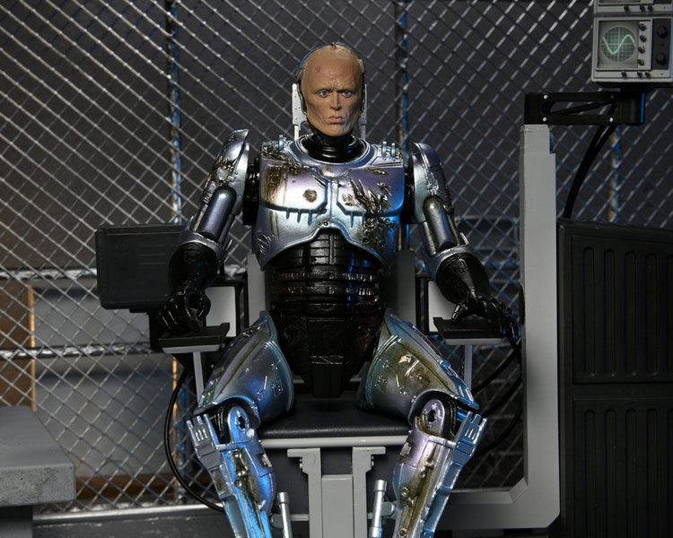 Figurka Ultimate Battle Damaged RoboCop with Chair - RoboCop Action Figure
